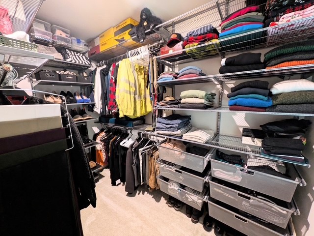 112 Wls Sta Road Seneca, SC 29678 - Photo 19 of 43 Organized shelving and storage systems maximize space in this carpeted walk-in primary closet.