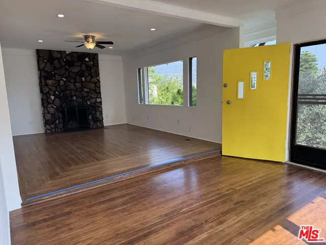 a view of entryway with wooden floor