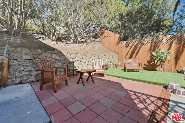 a view of a bench in a backyard