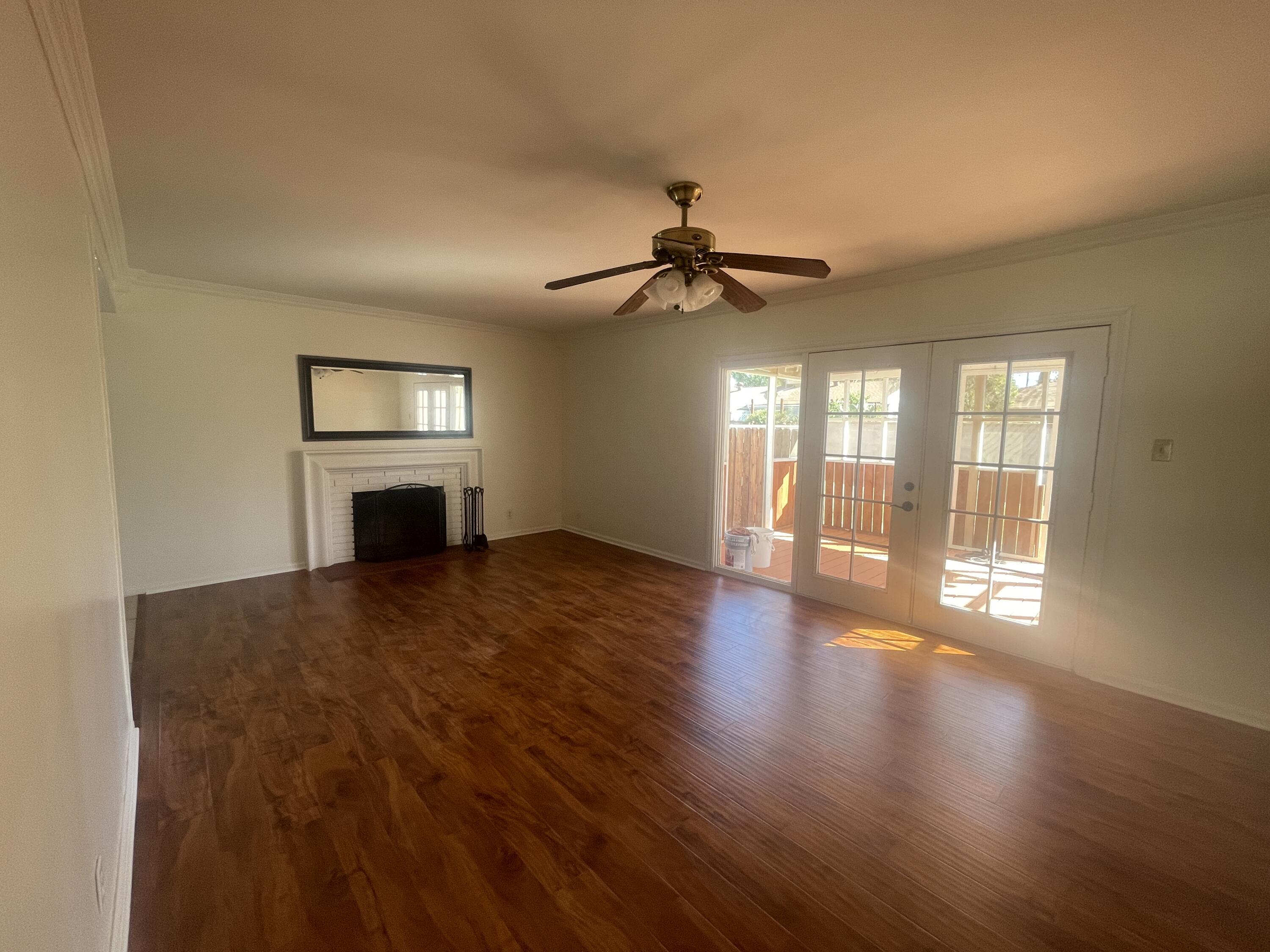 1372 Jenner Street Lancaster, CA 93534 - Photo 4 of 16 a view of empty room with wooden floor and fan
