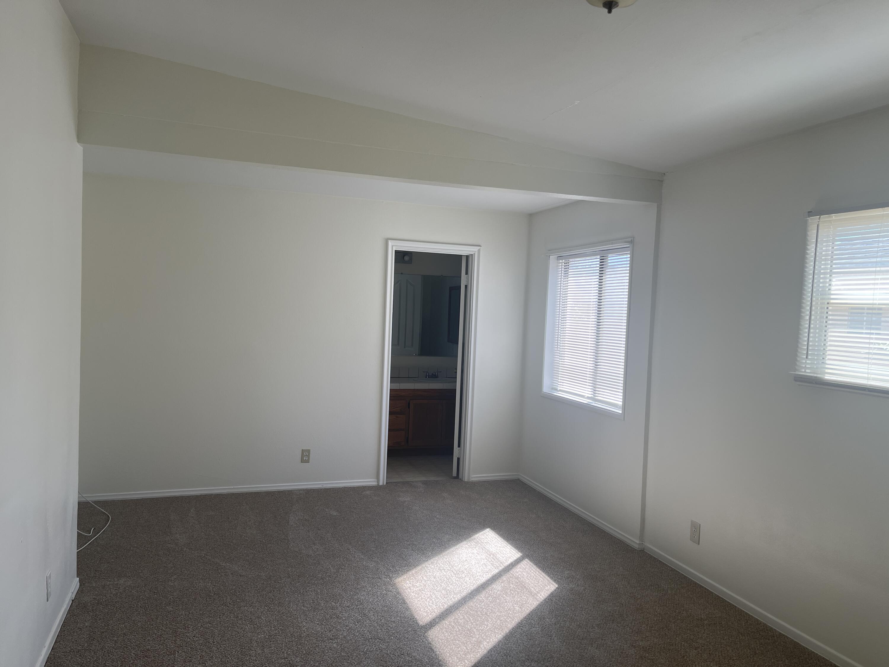 1372 Jenner Street Lancaster, CA 93534 - Photo 5 of 16 an empty room with windows