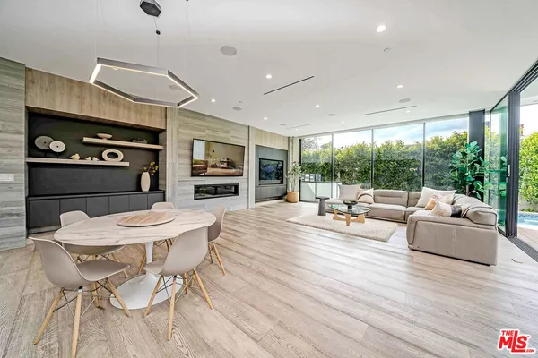 a kitchen with kitchen island granite countertop a center island a sink stainless steel appliances and cabinets