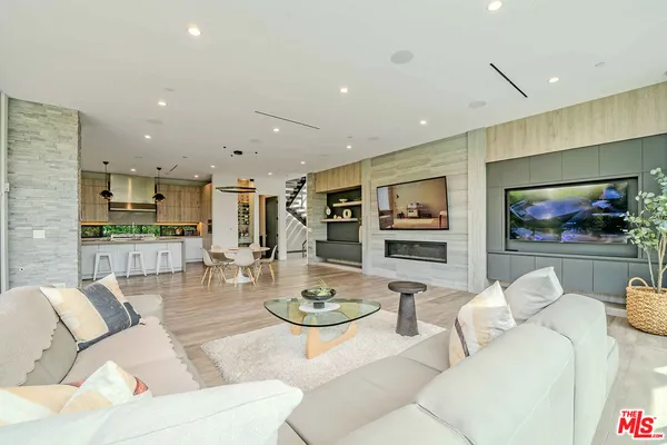 a bedroom with furniture and a flat screen tv