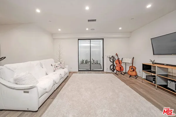 a bathroom with a toilet sink shower and mirror