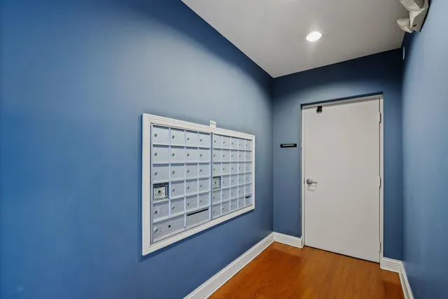 a view of room with window and wooden floor