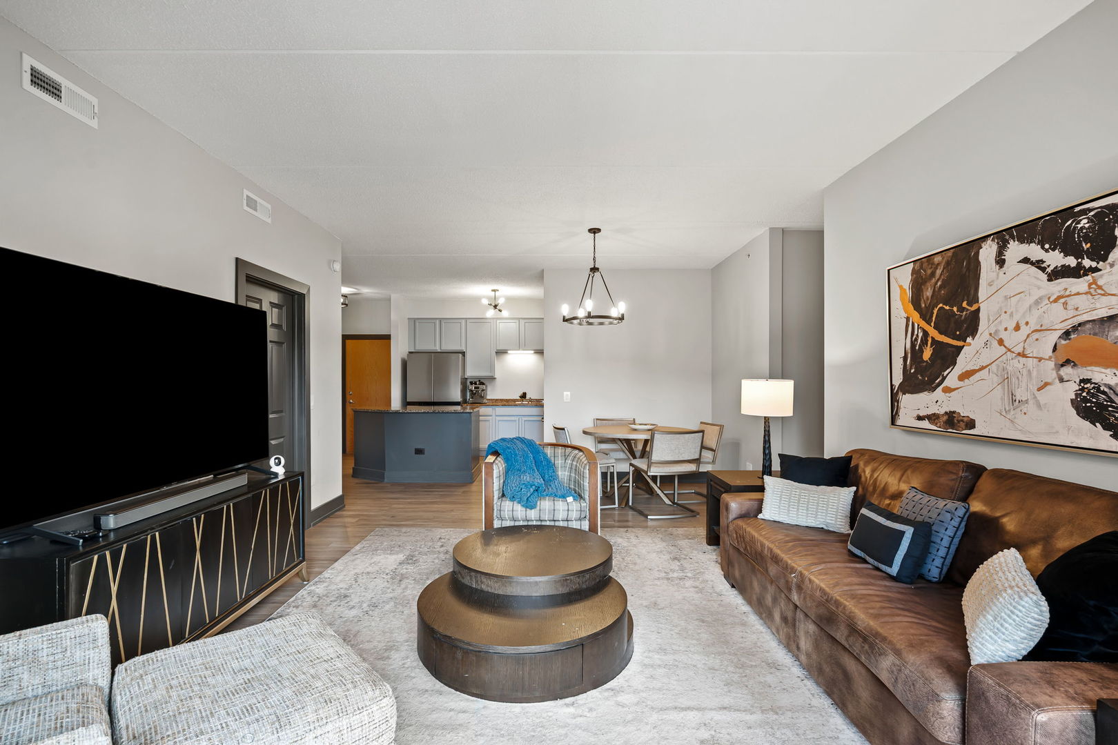 235 North Smith Street, Unit 412 Palatine, IL 60067 - Photo 10 of 18 a living room with furniture and a flat screen tv