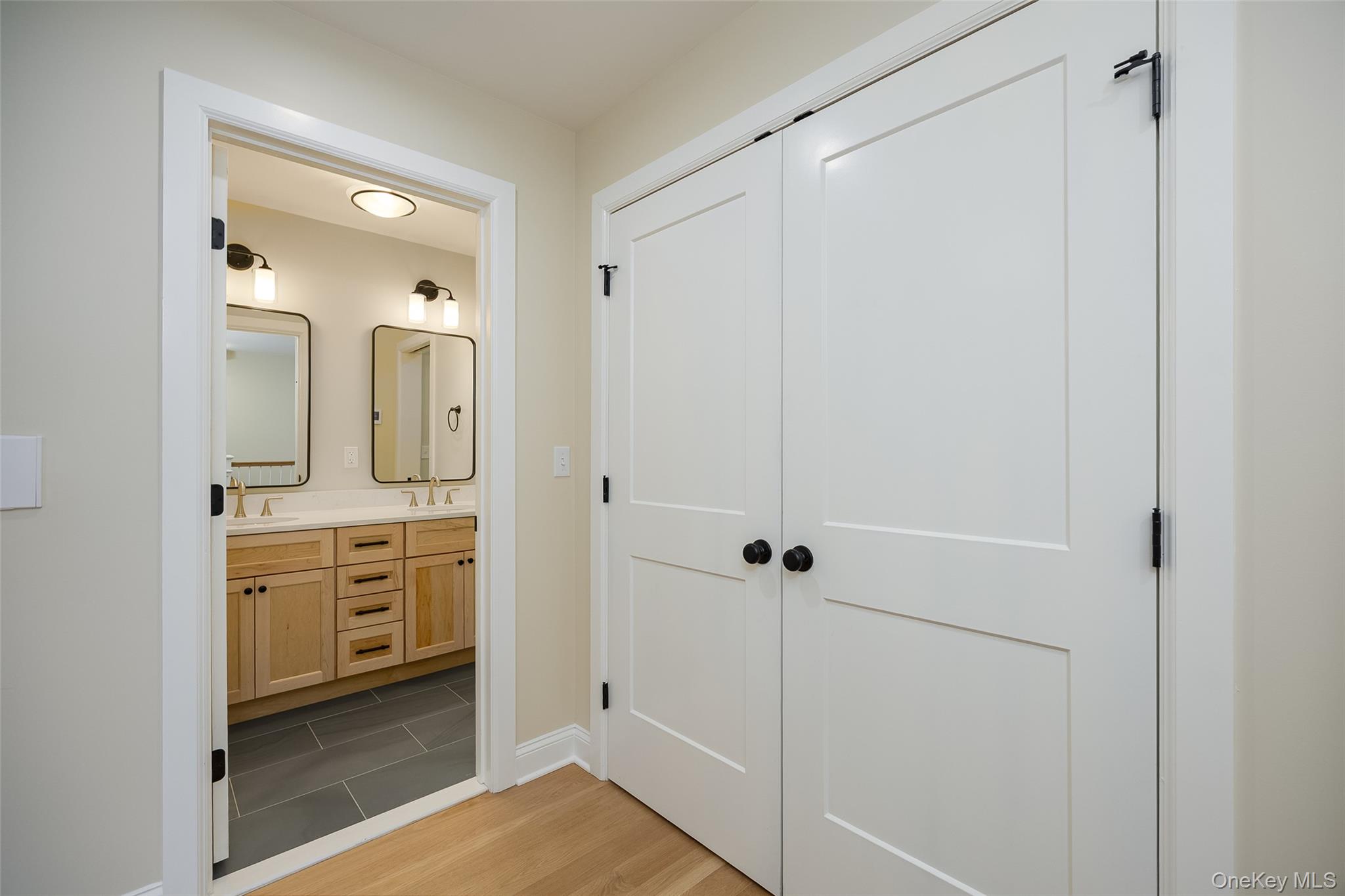 19 Henry Street, Unit 4 Beacon, NY 12508 - Photo 13 of 26 a bathroom with a granite countertop sink mirror and shower
