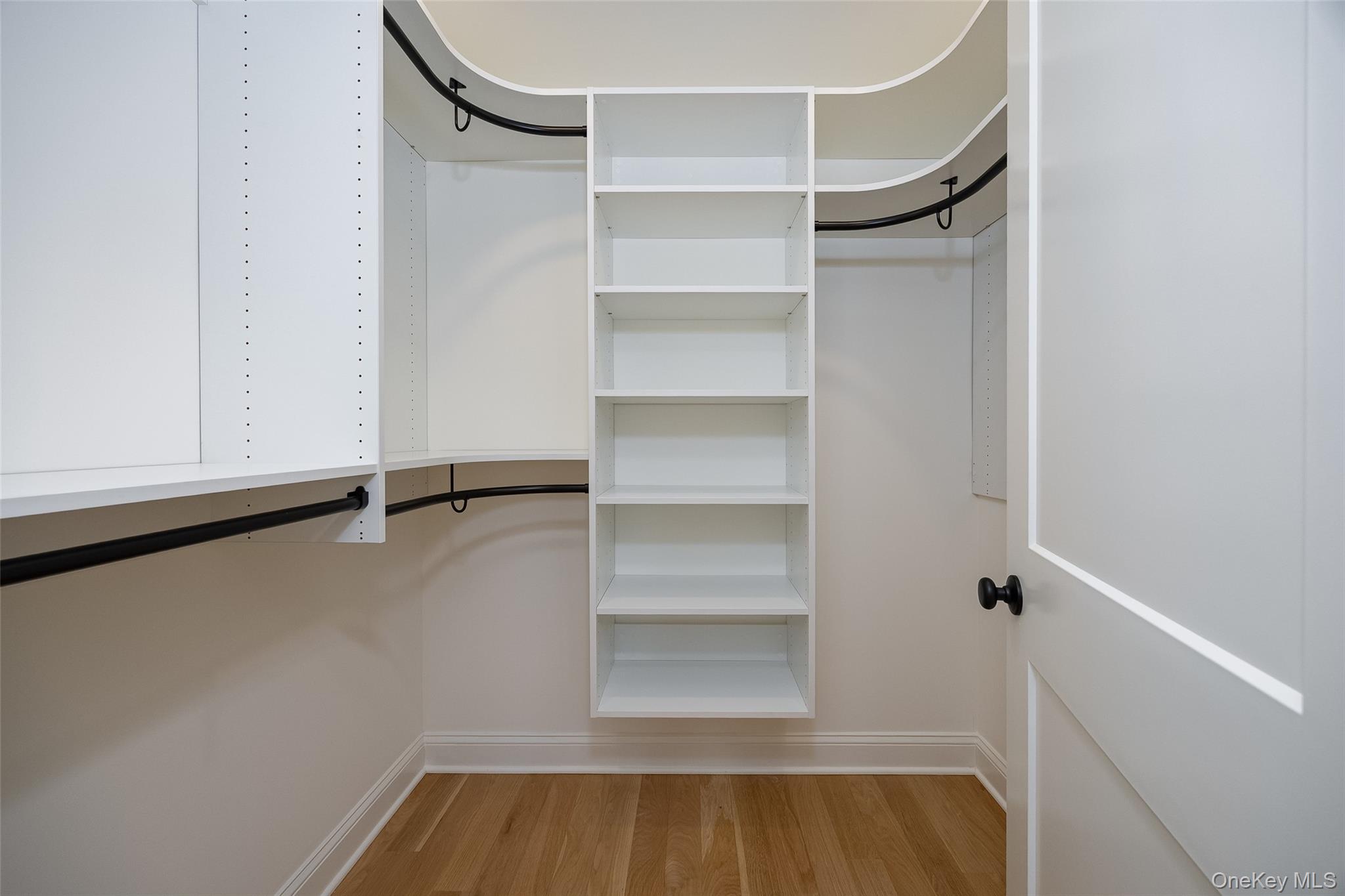 19 Henry Street, Unit 4 Beacon, NY 12508 - Photo 14 of 29 a view of walk in closet with empty racks