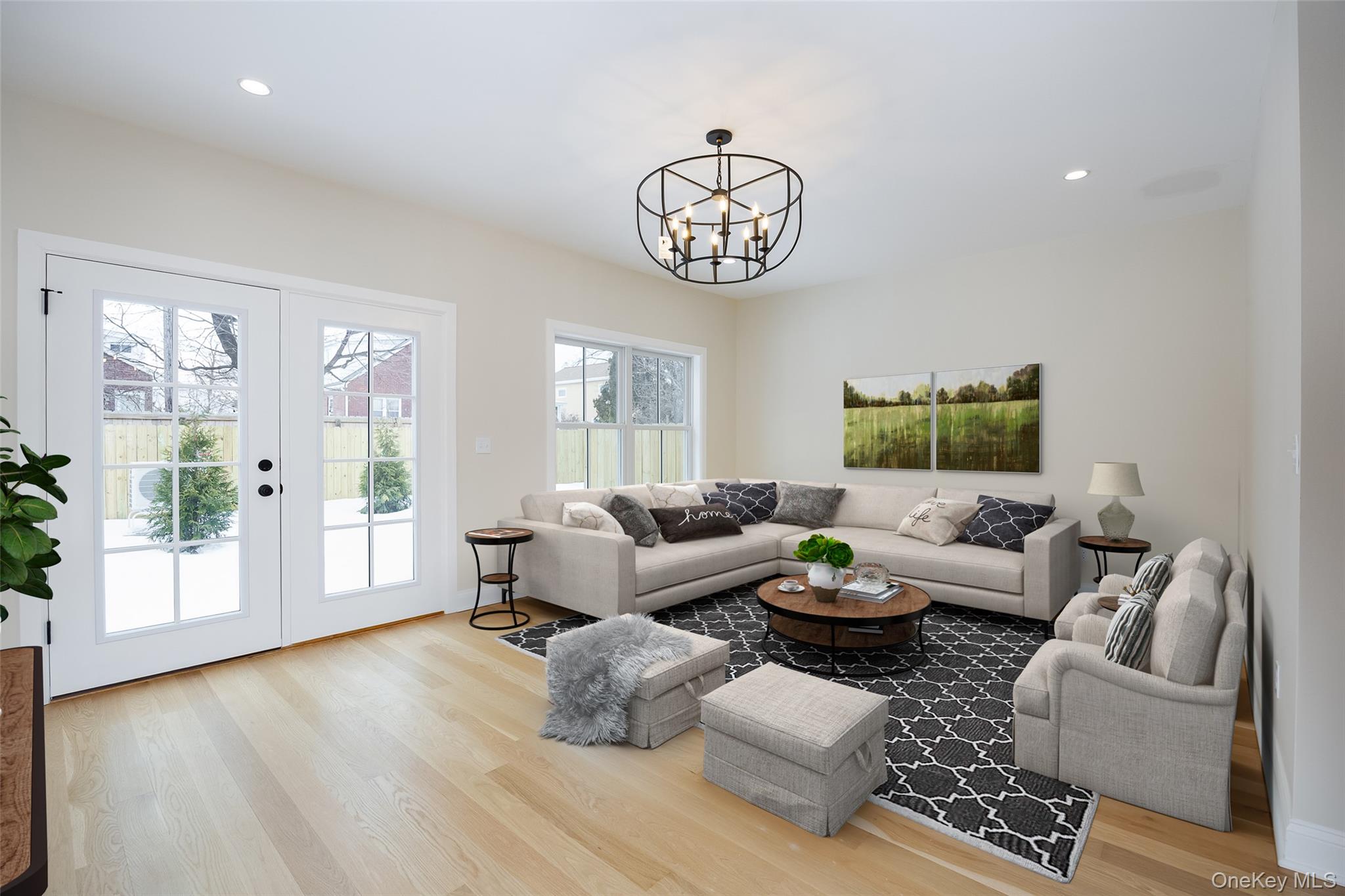 19 Henry Street, Unit 4 Beacon, NY 12508 - Photo 5 of 29 a living room with furniture wooden floor and a large window