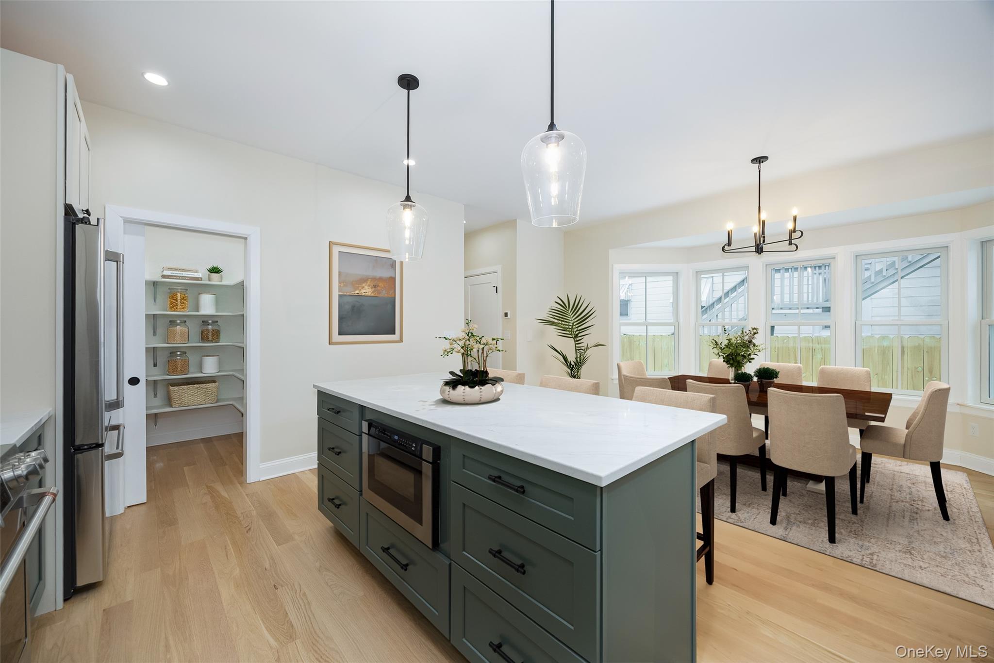 19 Henry Street, Unit 4 Beacon, NY 12508 - Photo 8 of 29 a view of a kitchen counter space dining table and chairs