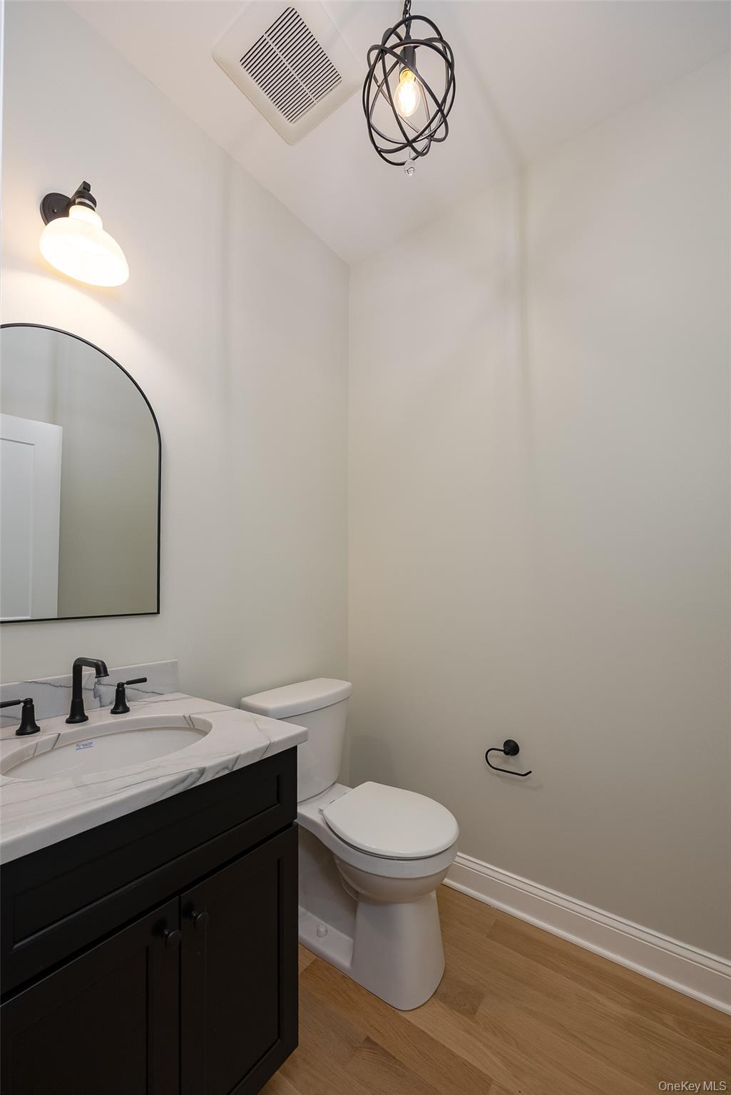 19 Henry Street, Unit 4 Beacon, NY 12508 - Photo 9 of 29 a bathroom with a sink a toilet and a mirror
