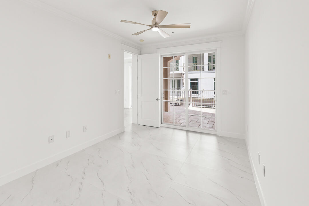47 Southwest Osceola Street, Unit 206 Stuart, FL 34994 - Photo 11 of 47 an empty room with a empty space and windows