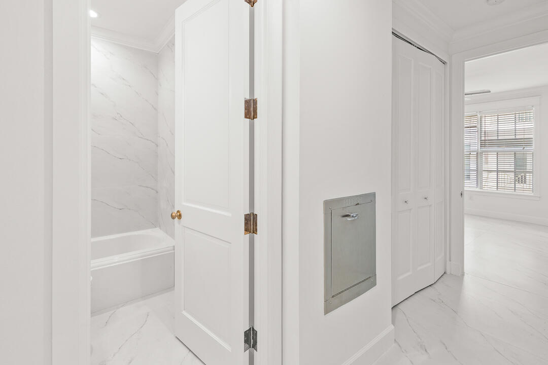 47 Southwest Osceola Street, Unit 206 Stuart, FL 34994 - Photo 19 of 47 a bathroom with a bathtub