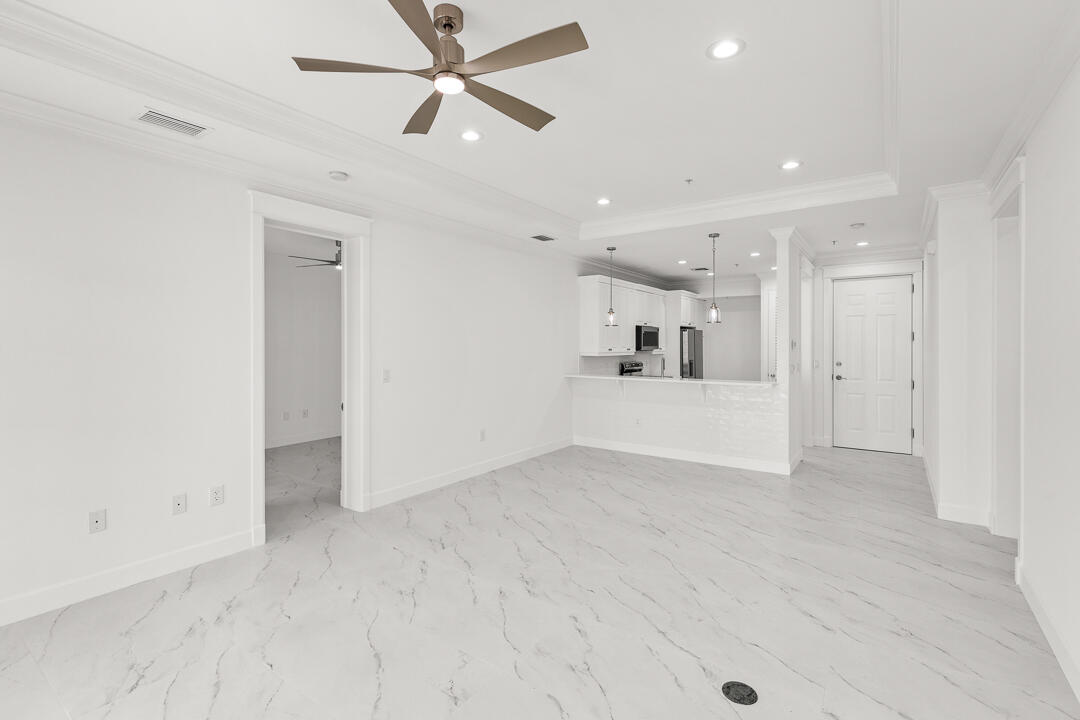 47 Southwest Osceola Street, Unit 206 Stuart, FL 34994 - Photo 2 of 47 a view of a big room with wooden floor and windows