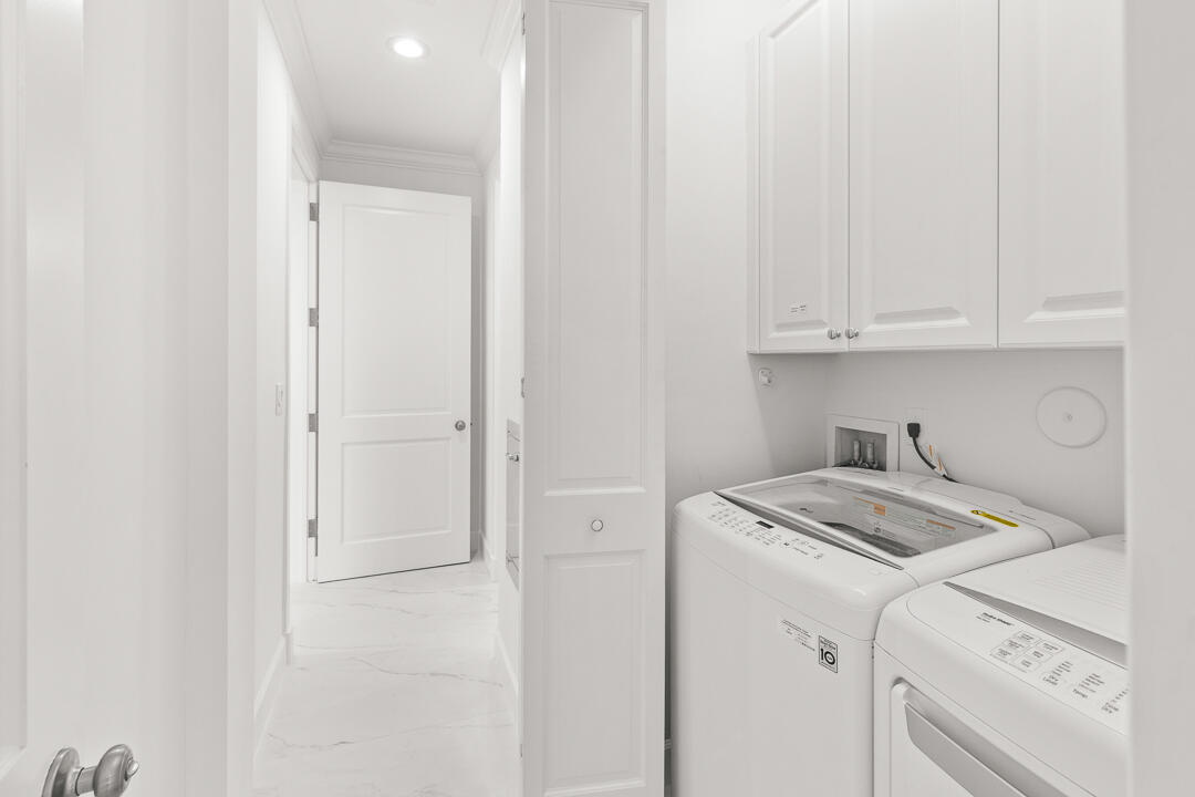 47 Southwest Osceola Street, Unit 206 Stuart, FL 34994 - Photo 23 of 47 a view of a storage and utility room with washer and dryer