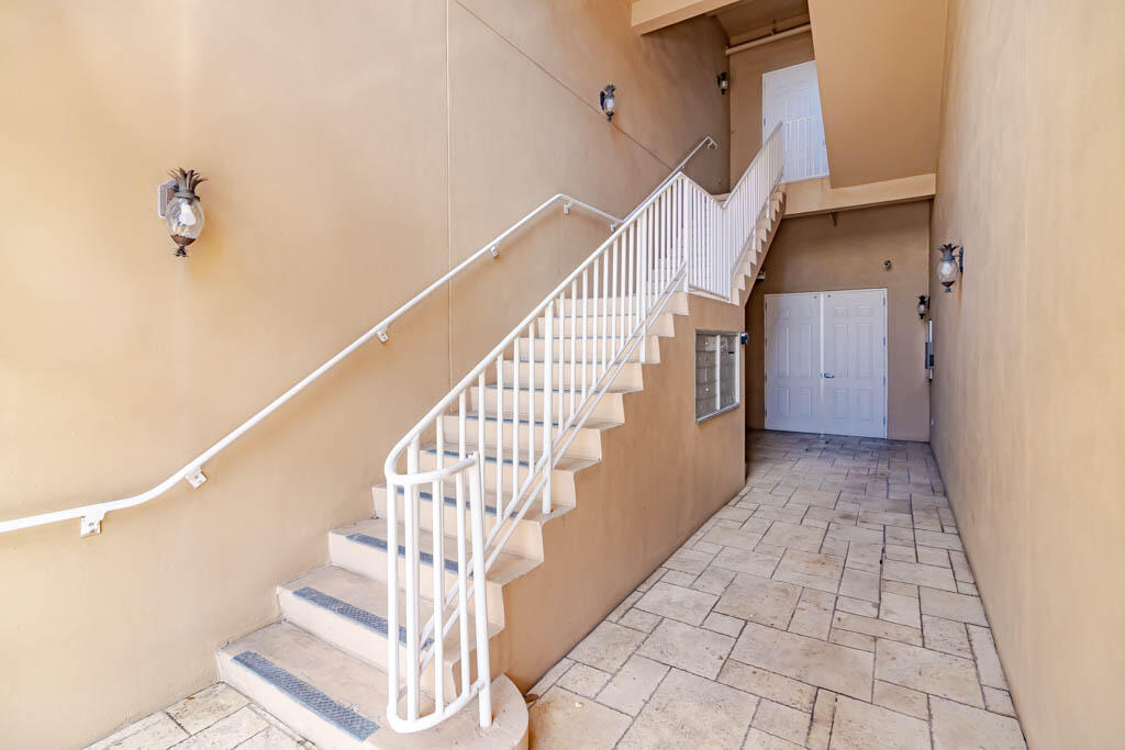 47 Southwest Osceola Street, Unit 206 Stuart, FL 34994 - Photo 37 of 47 a view of entryway and hall with wooden floor