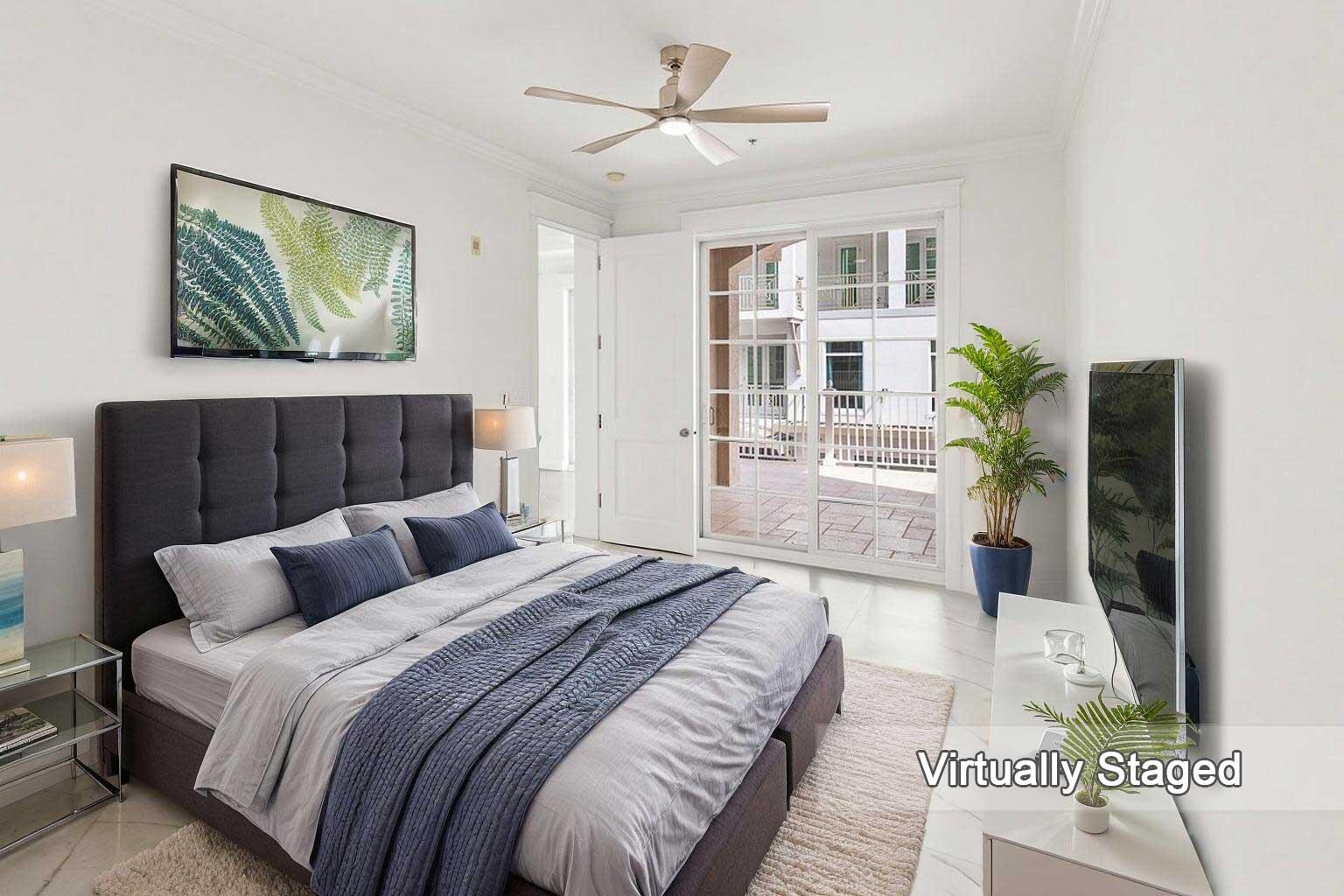 47 Southwest Osceola Street, Unit 206 Stuart, FL 34994 - Photo 9 of 47 a bedroom with bed and a couch