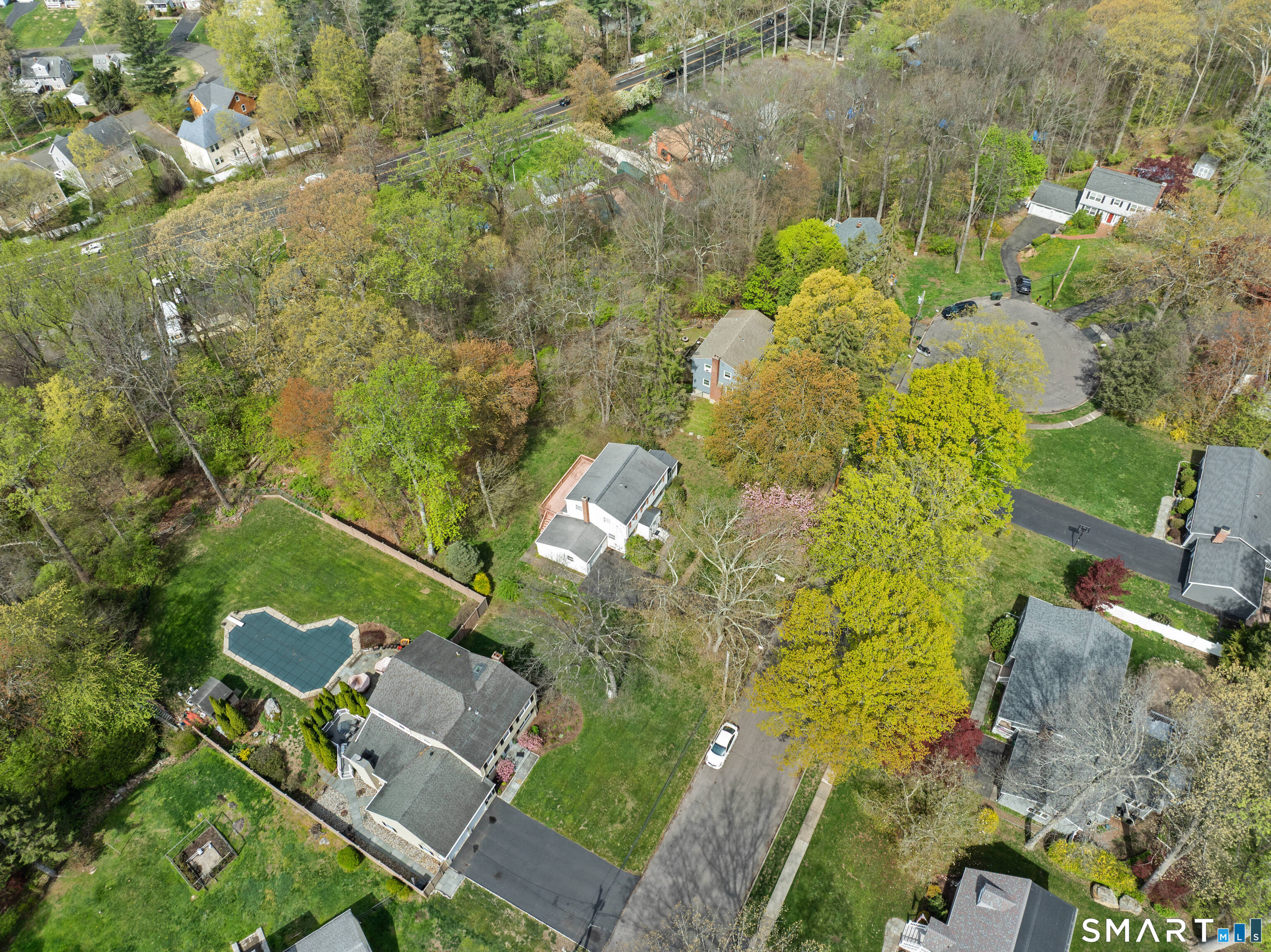 251 Shelter Rock Road Fairfield, CT 06825 - Photo 4 of 38 an aerial view of a house with a yard and lake view