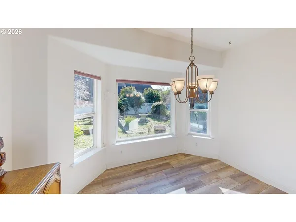 a bedroom with a bed and a view of living room