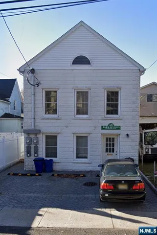 a car parked in front of a house