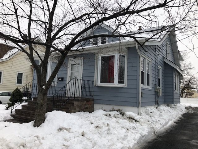27 Roosevelt Street, Unit 2 Little Ferry, NJ 07643 - Photo 1 of 1 a view of a house covered in snow