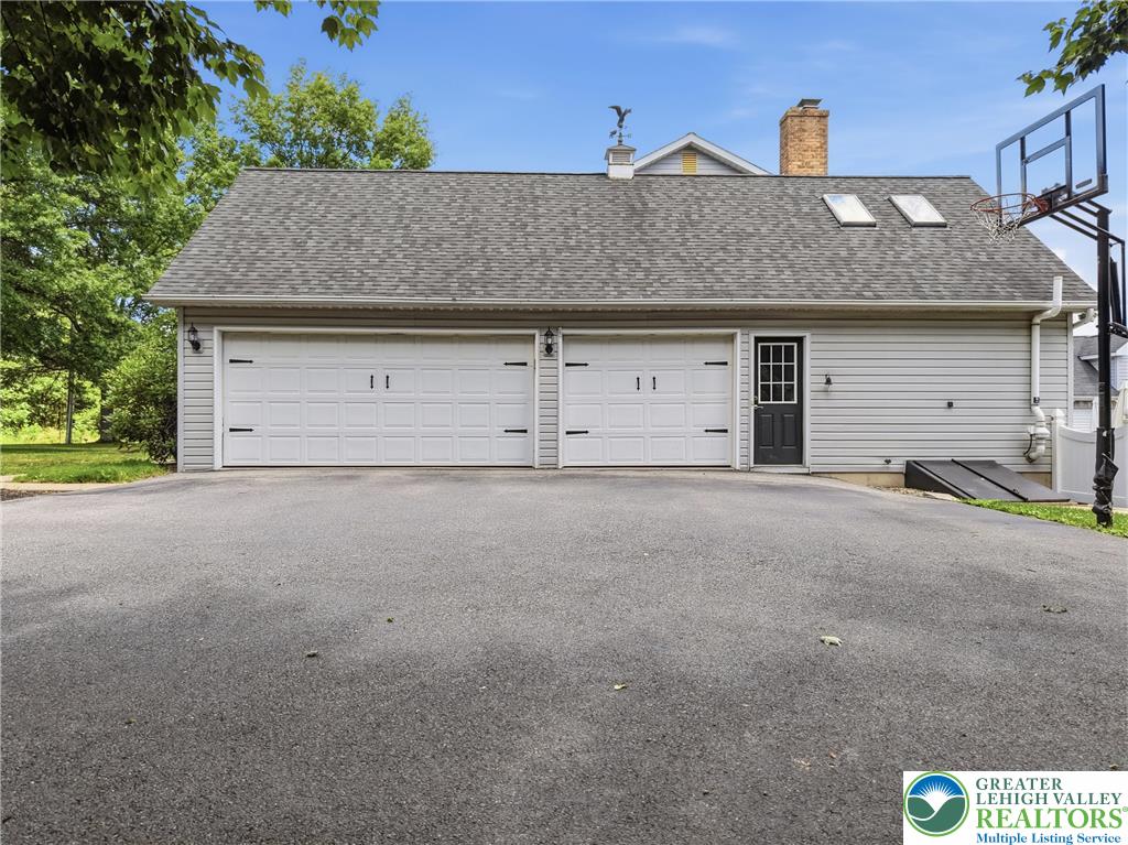 890 Lahr Road Nazareth, PA 18064 - Photo 58 of 71 Two oversized garage doors offer ample parking and direct entry, complemented by a convenient side entrance.