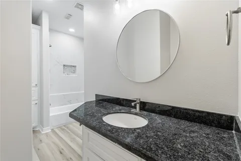 a bathroom with a bathtub and a toilet
