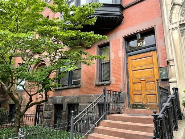 a view of a house with a tree