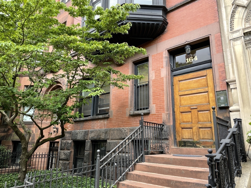 164 Beacon Street, Unit 1 Boston, MA 02116 - Photo 12 of 12 a view of a house with a tree