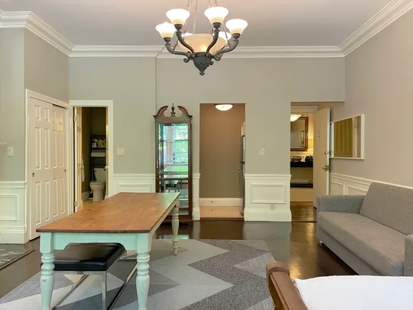 a view of a livingroom with furniture and wooden floor