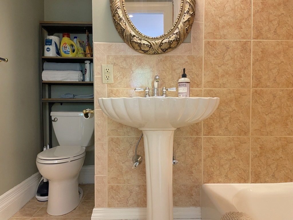 164 Beacon Street, Unit 1 Boston, MA 02116 - Photo 10 of 12 a bathroom with a sink and a mirror