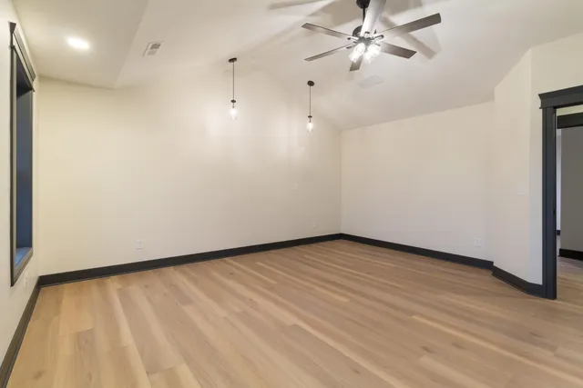 a view of an empty room with a window