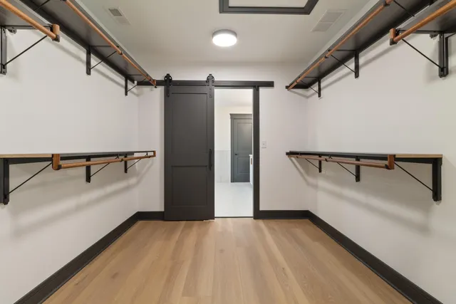 a view of a hallway with stairs