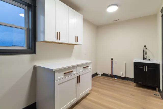 a kitchen with a stove and a sink