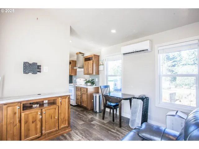 a kitchen with sink refrigerator and window