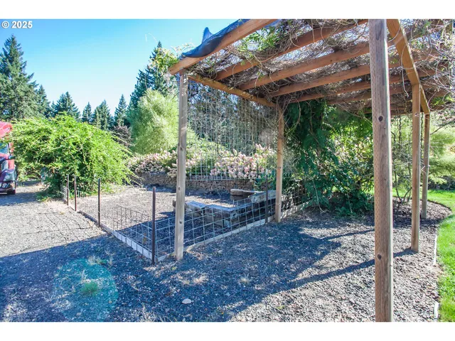 a view of a chairs and table on the patio