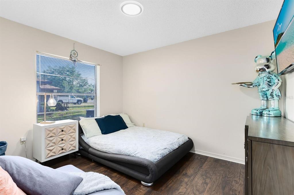 106 Edgewater Drive St. Cloud, FL 34769 - Photo 11 of 18 a bedroom with a bed and window