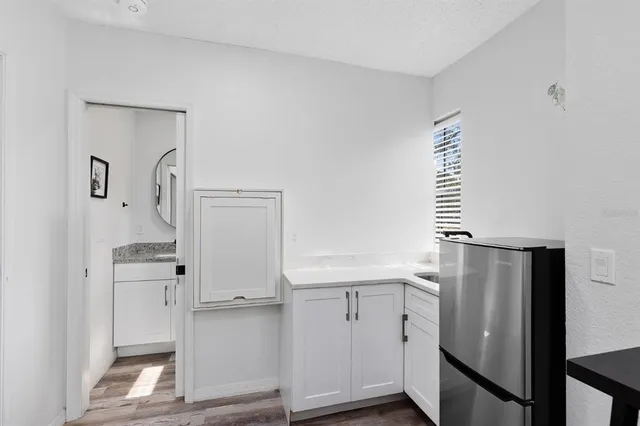 a view of kitchen with wooden floor