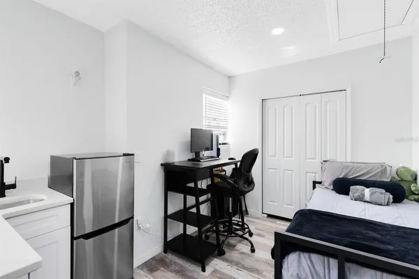 a bedroom with a bed and a table