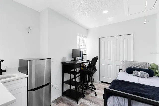 a bedroom with a bed and a table