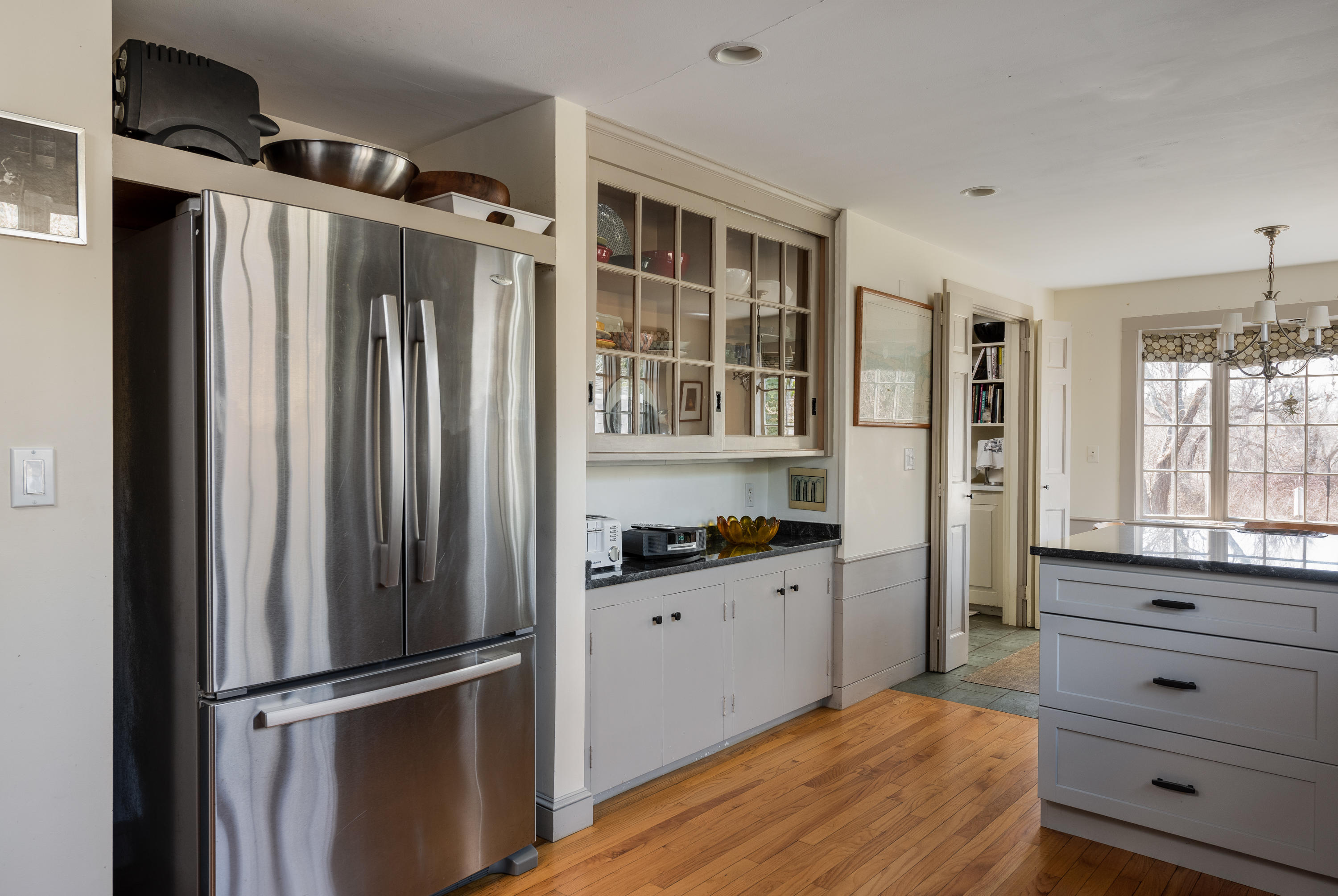 115 Rendezvous Lane Barnstable, MA 02630 - Photo 11 of 34 a kitchen with granite countertop a refrigerator and a wooden floor