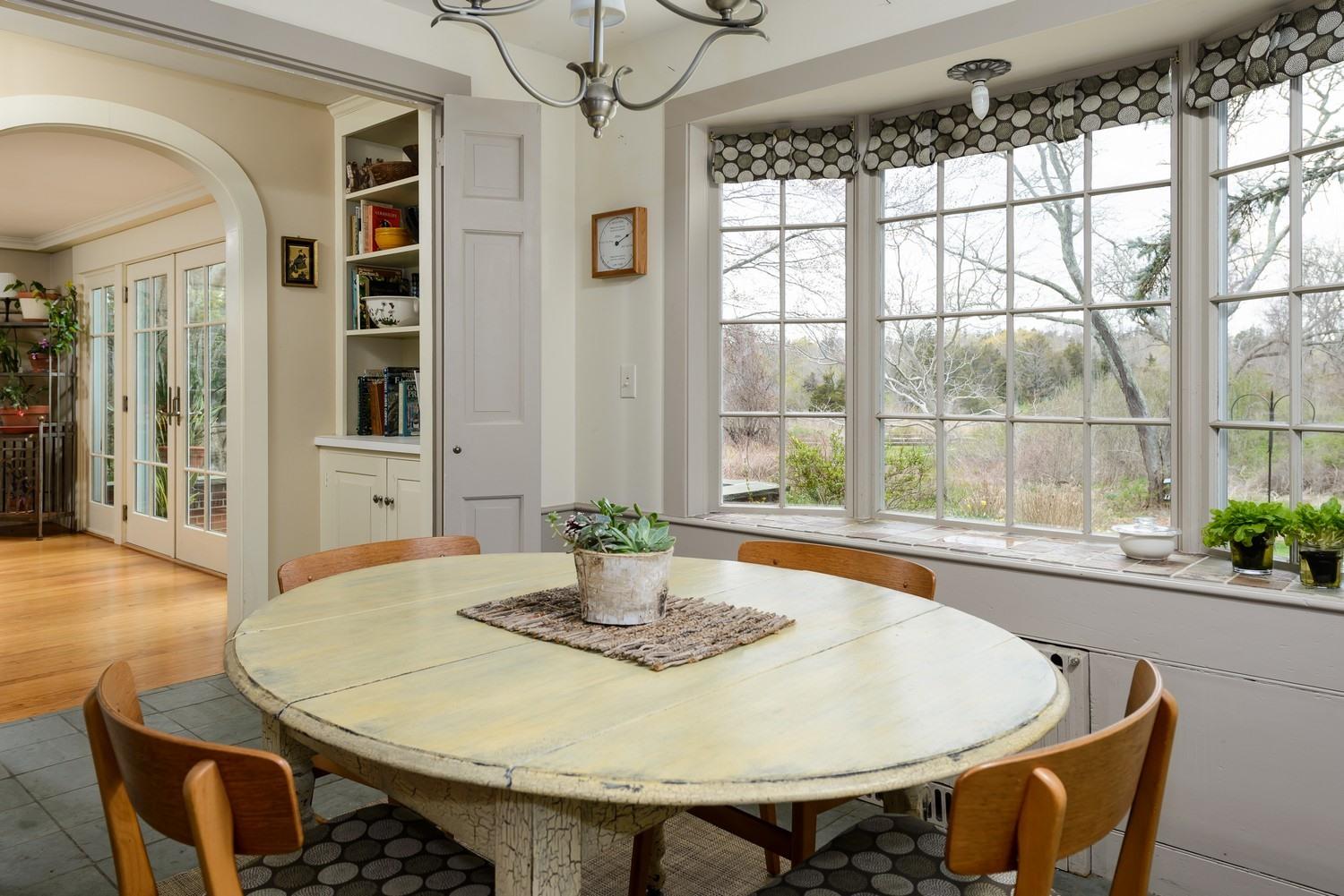 115 Rendezvous Lane Barnstable, MA 02630 - Photo 12 of 34 a dining room with furniture window and wooden floor