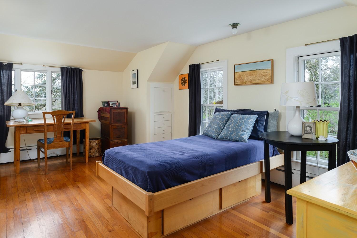 115 Rendezvous Lane Barnstable, MA 02630 - Photo 26 of 34 a bed room with a bed and a table