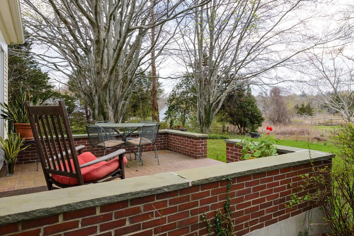 115 Rendezvous Lane Barnstable, MA 02630 - Photo 28 of 34 a view of a bench in a patio