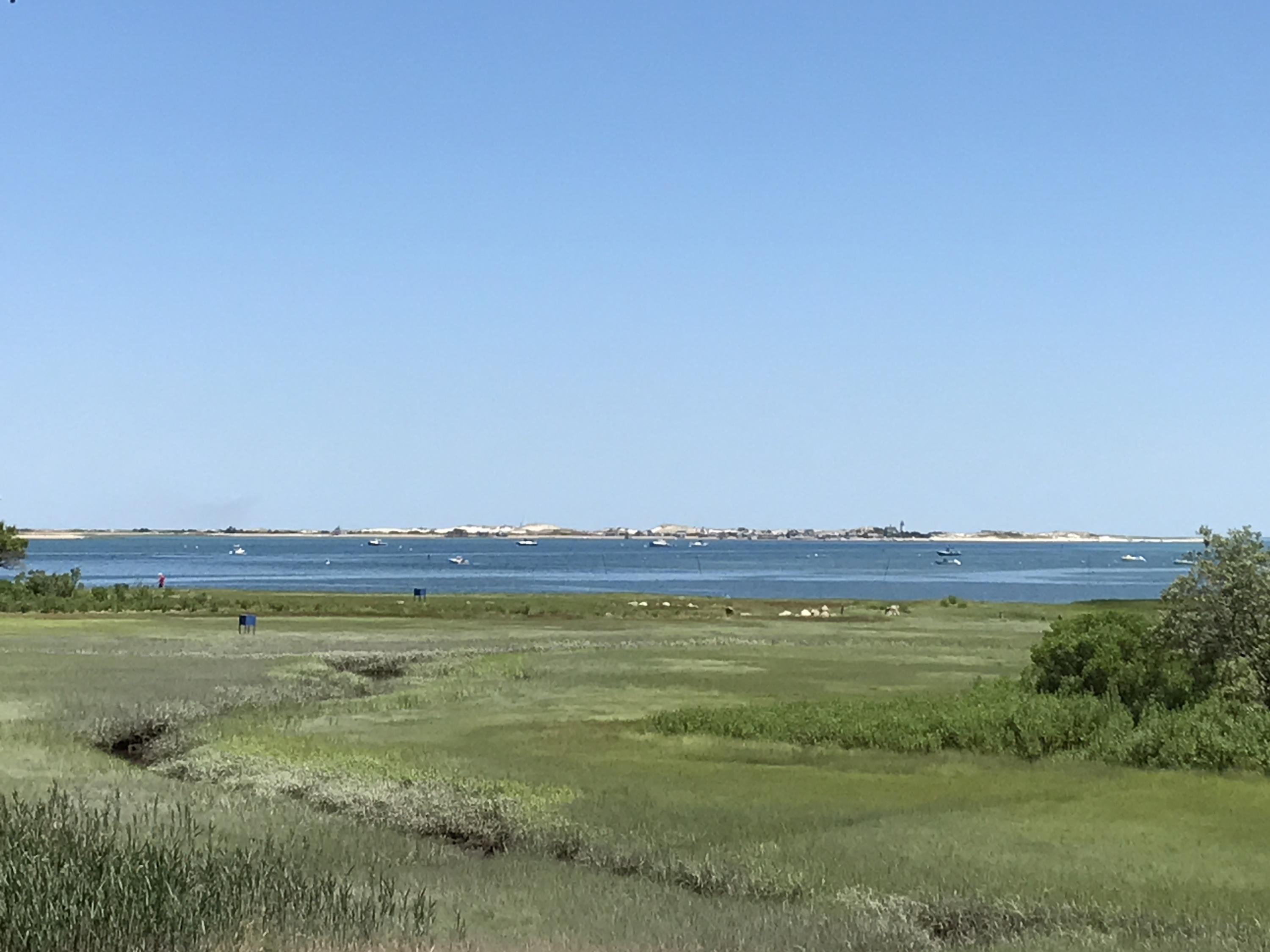 115 Rendezvous Lane Barnstable, MA 02630 - Photo 33 of 34 a view of a lake with houses in the background