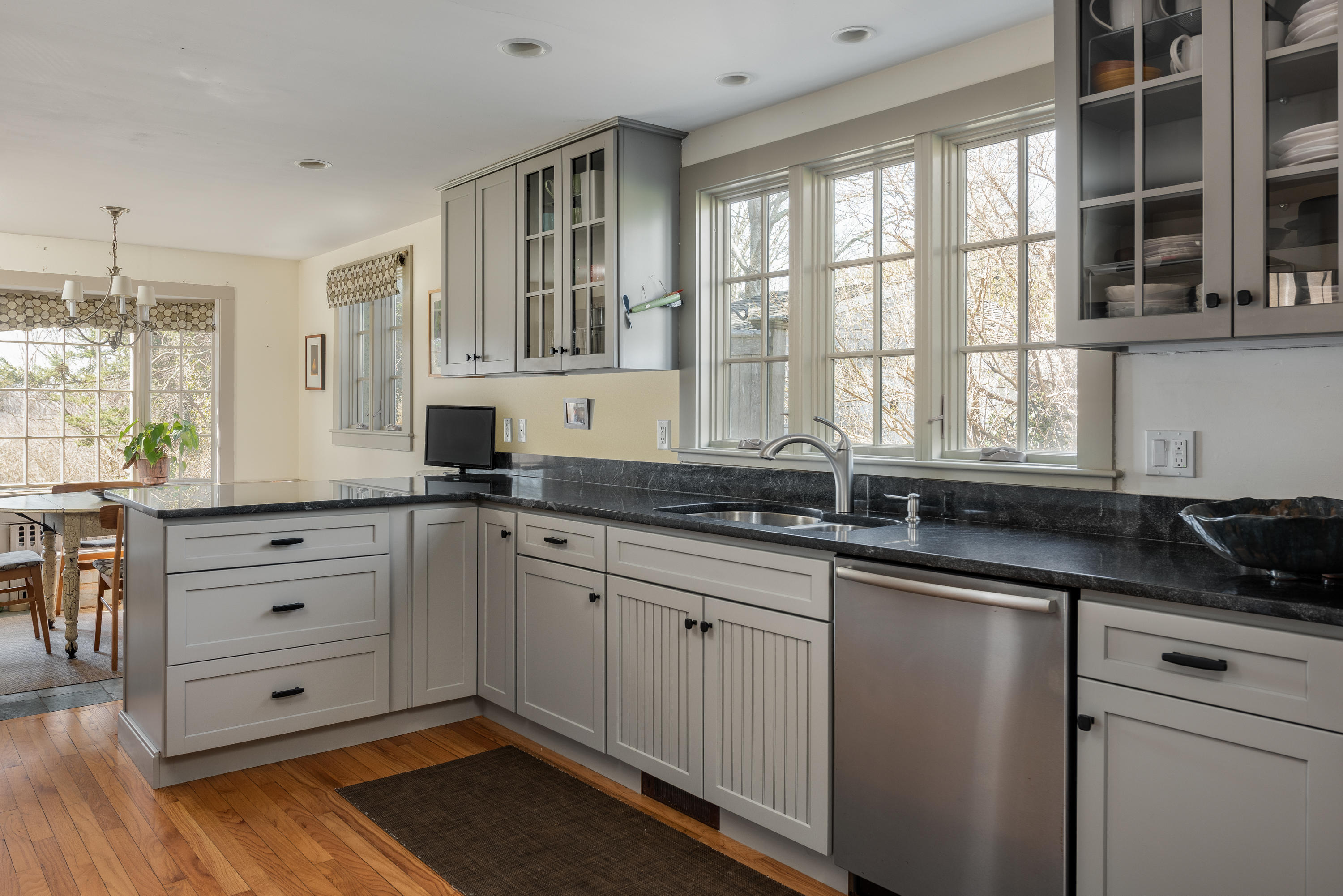 115 Rendezvous Lane Barnstable, MA 02630 - Photo 9 of 34 a kitchen with stainless steel appliances granite countertop a sink a stove and cabinets
