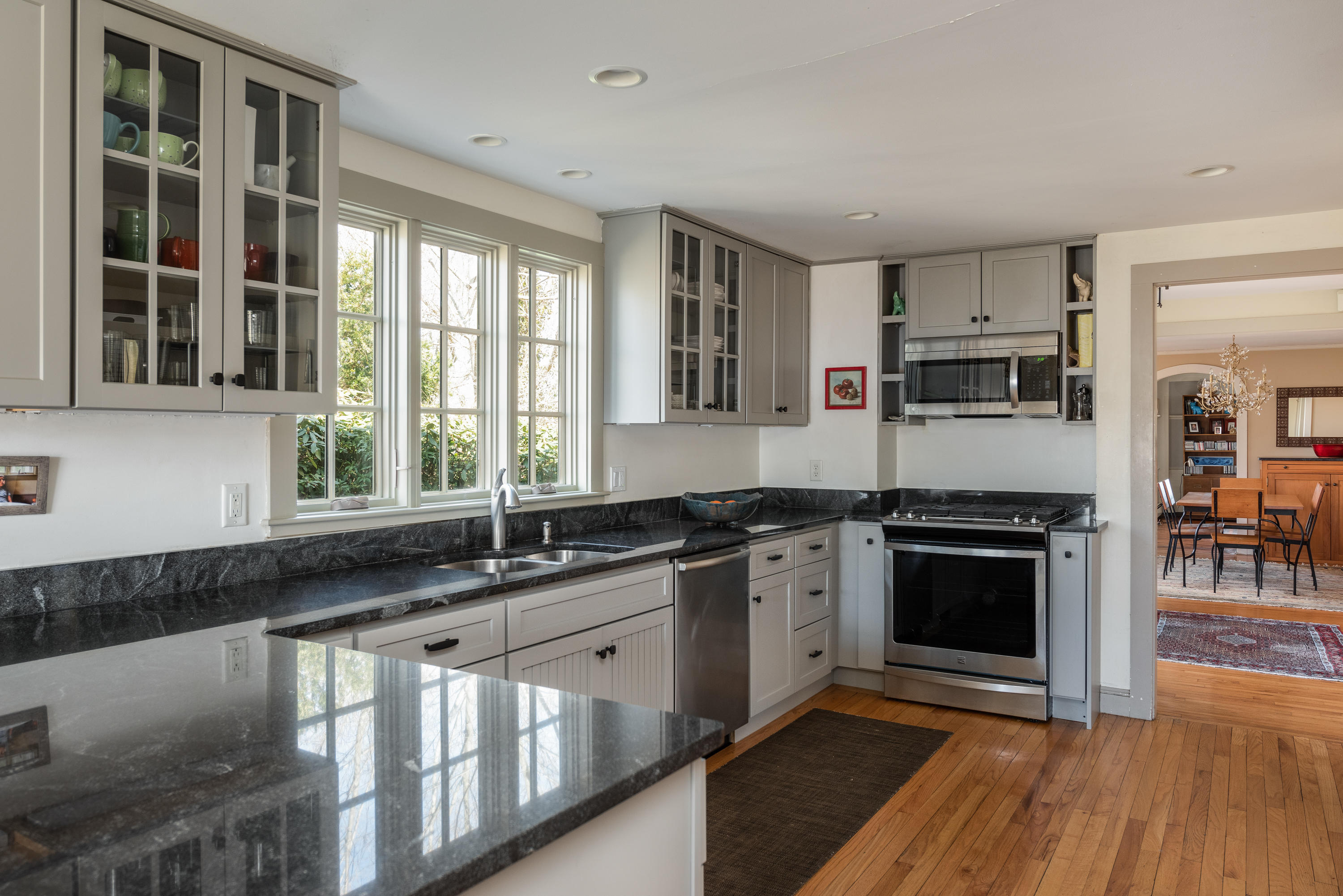 115 Rendezvous Lane Barnstable, MA 02630 - Photo 10 of 34 a kitchen with stainless steel appliances granite countertop a stove a sink and a microwave