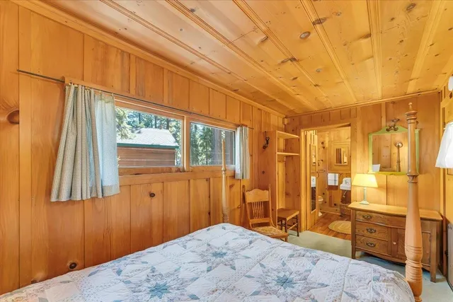 a bathroom with a toilet tub shower and a sink
