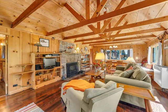 a outdoor living space with patio furniture and a fireplace