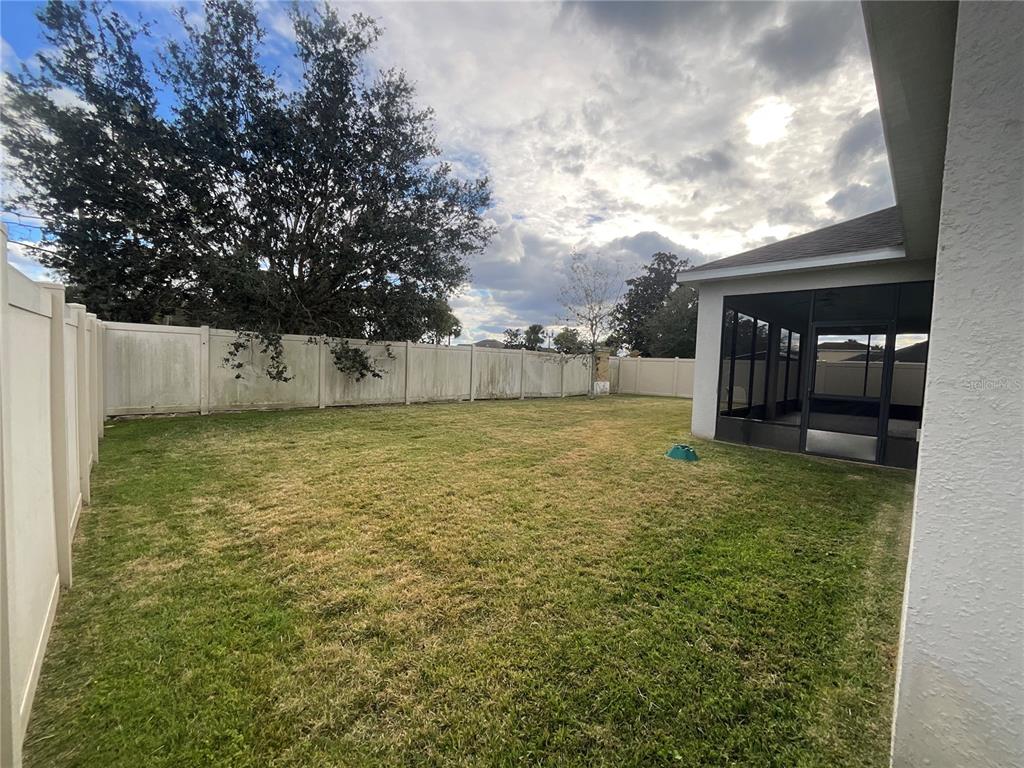 3560 Pixie Lane St. Cloud, FL 34772 - Photo 12 of 74 a view of a yard